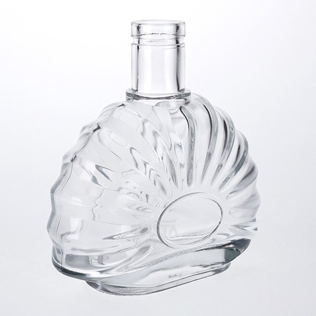 Factory wholesale brandy bottles custom cork shell carved water drop type glass bottles high quality spirit bottles