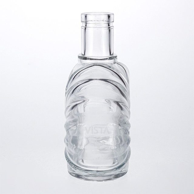 Factory wholesale brandy bottles custom cork shell carved water drop type glass bottles high quality spirit bottles