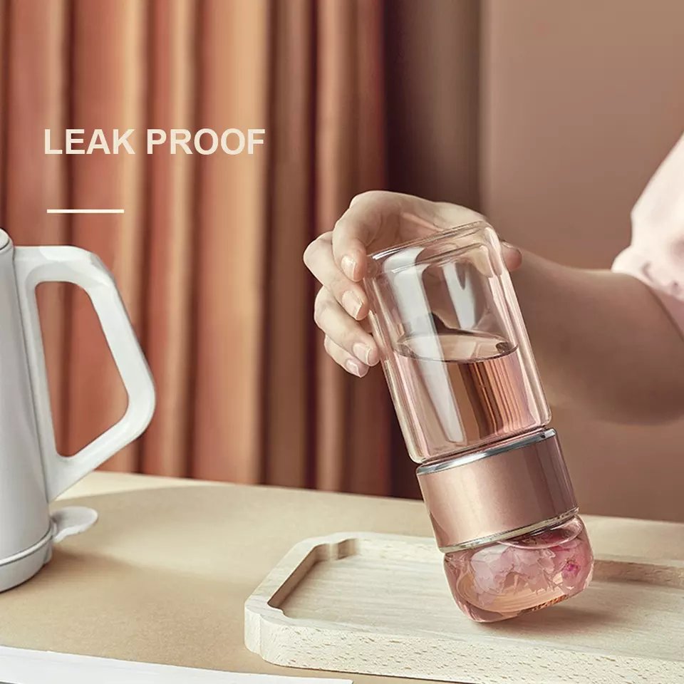glass water bottle with tea infuser on bottom for hot iced tea
