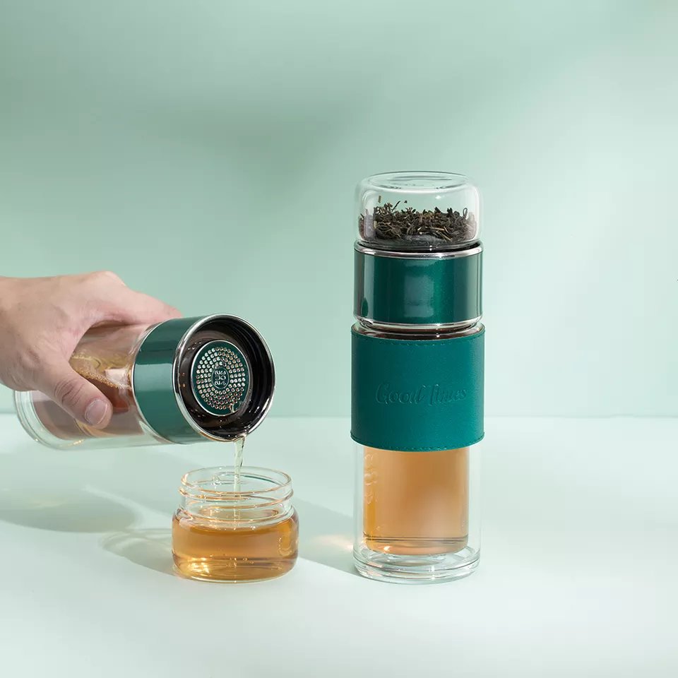 glass water bottle with tea infuser on bottom for hot iced tea