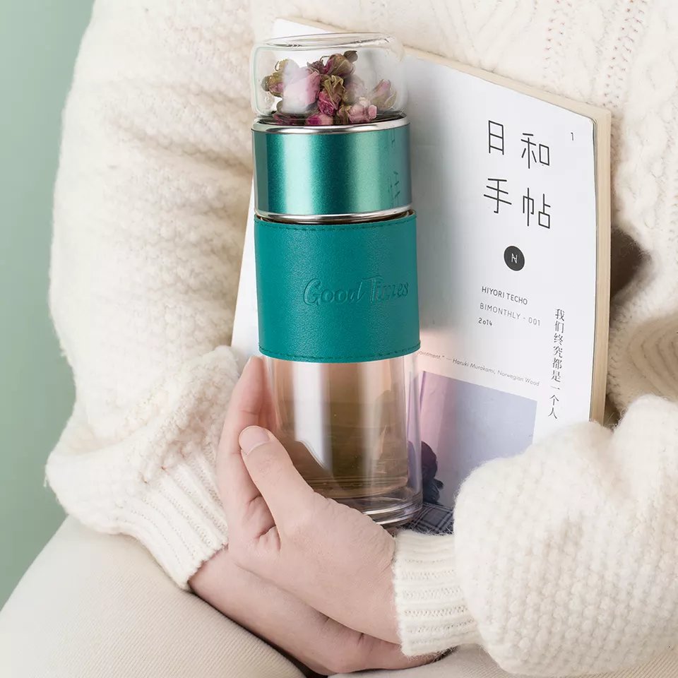 glass water bottle with tea infuser on bottom for hot iced tea