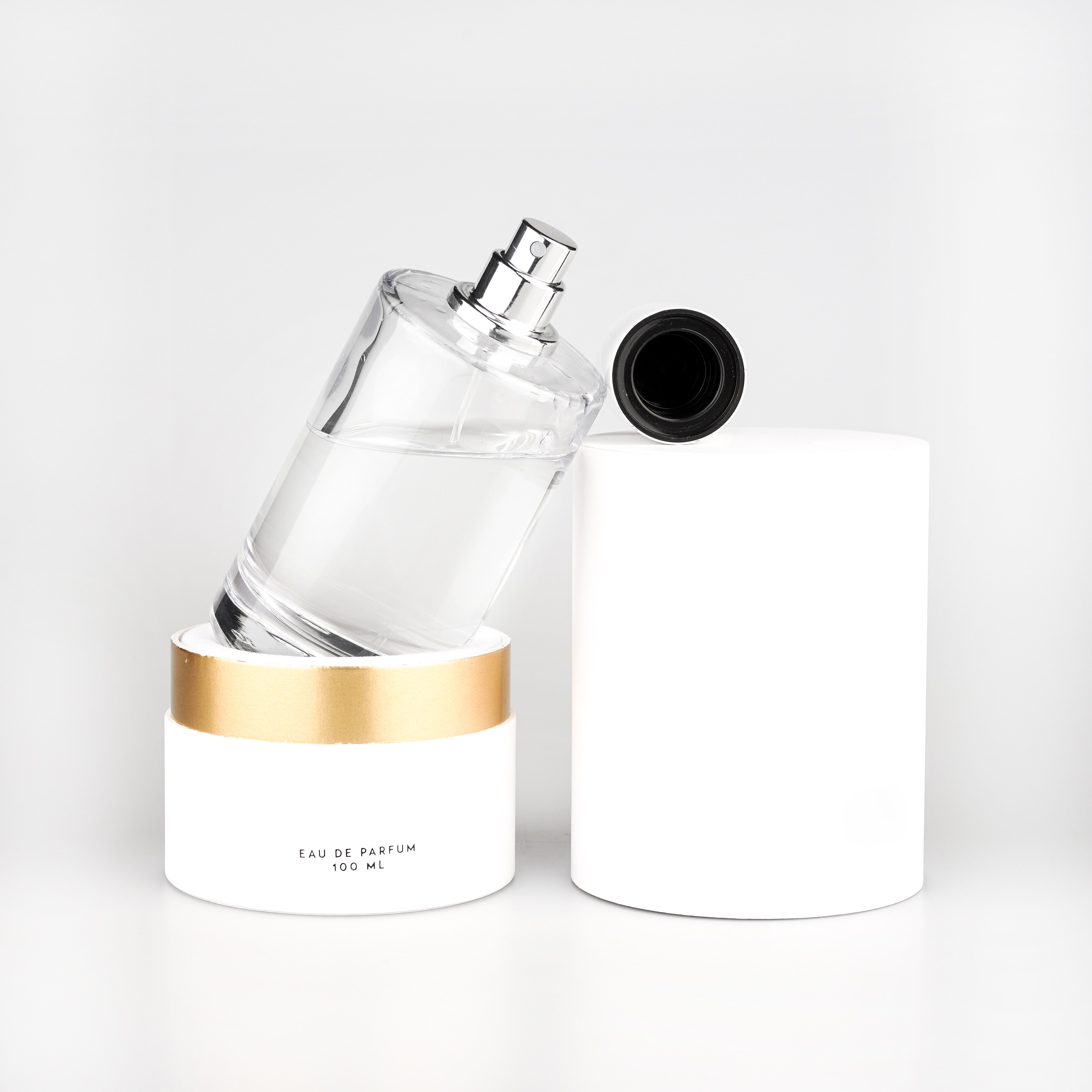 Wholesale clear cylinder 50 ml 100 ml empty perfume spray glass bottle with customized magnetic cap