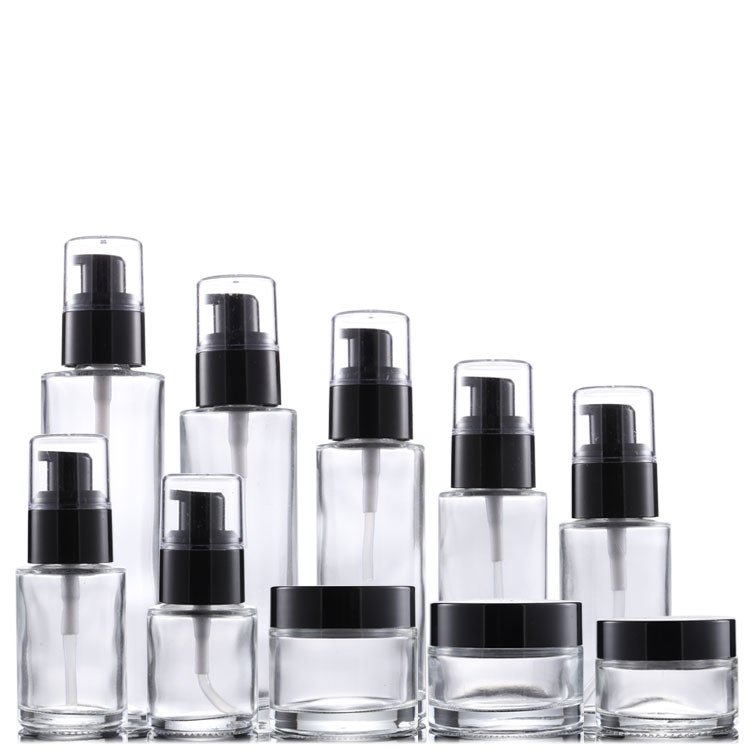 Factory wholesale transparent black cap customized model complete pump plastic sprayer Cosmetic lotion travel glass bottle