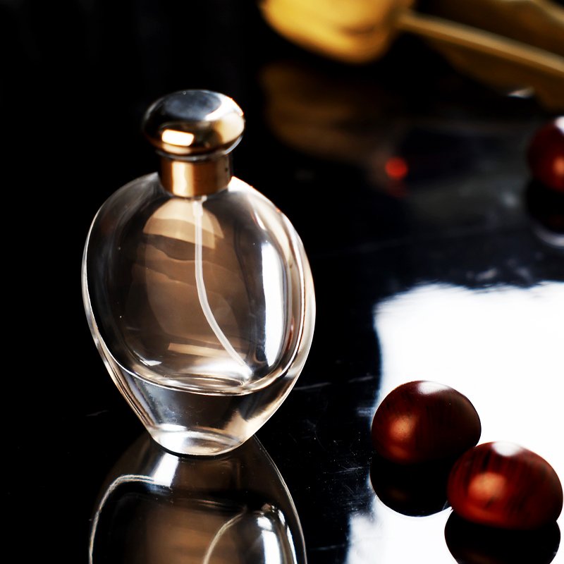 Hot Selling Wholesale 50ml 100ml Oval Shape New Design Luxury Refill Fine Mist Spray Pump Perfume Glass Bottle Supplier with Lid