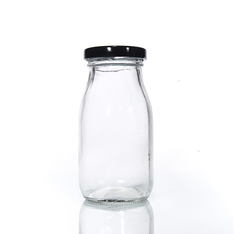 Wholesale Free Sample 100ml 200ml 250ml 500ml 1000ml Clear Empty Recycled Round Glass Milk Bottles With Screw Lid