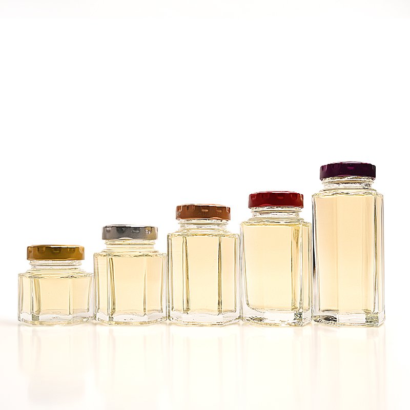 China Wholesale Cheap Custom Empty Clear Food Grade Storage Hexagonal Glass Honey Jam Jar with Screw Lids