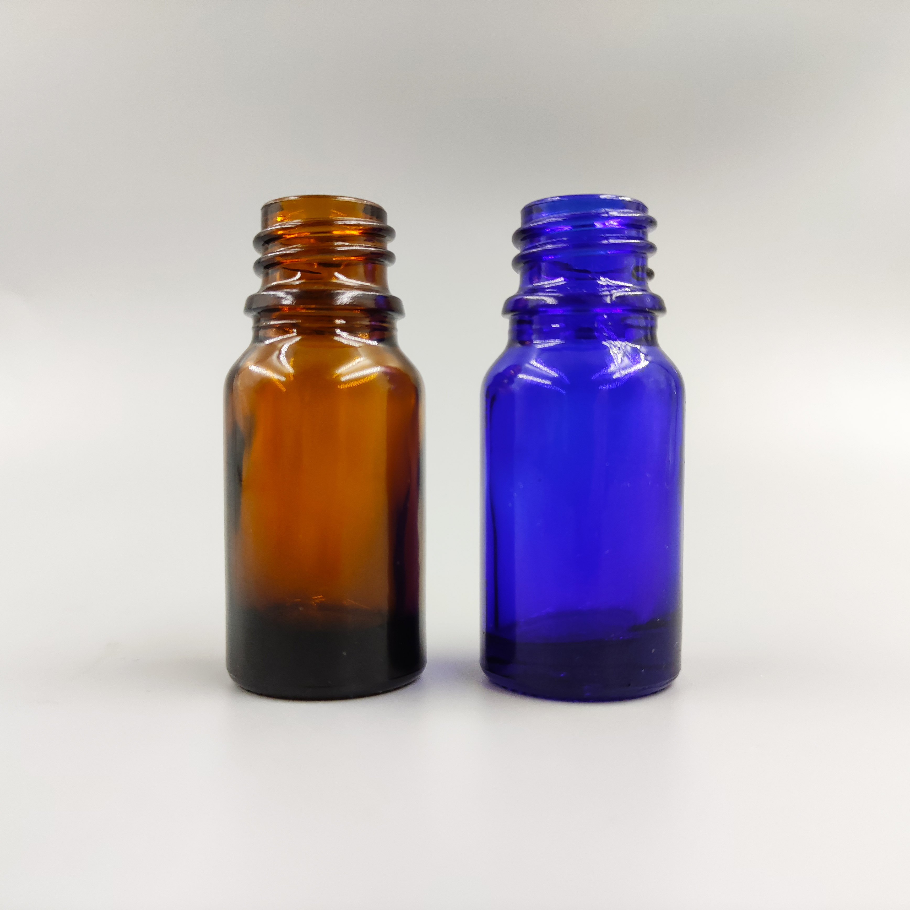 5ml,10ml,15ml,20ml,30ml,50ml,100ml,120ml custom factory wholesale colorful empty glass bottle suppliers