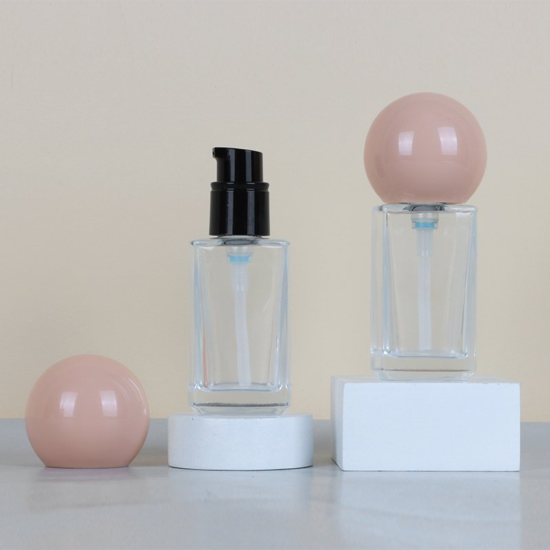 Simple and customizable color and logo 30ml Foundation Essence glass bottle emulsion cosmetic packaging with skin color ball cap