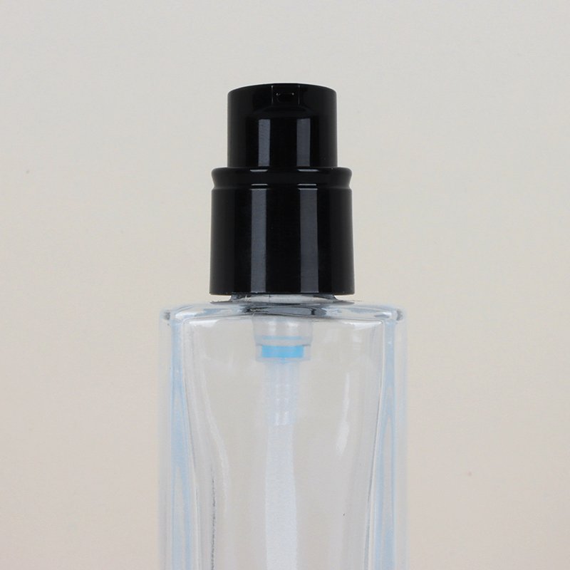 Simple and customizable color and logo 30ml Foundation Essence glass bottle emulsion cosmetic packaging with skin color ball cap