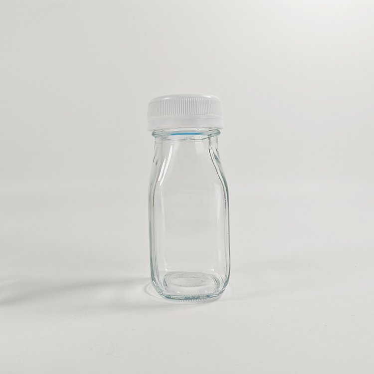 Wholesale recyclable 100ml Clear Beverage Square Glass Bottle Cold Press Fruit Juice Bottles With Airtight Screw Cap