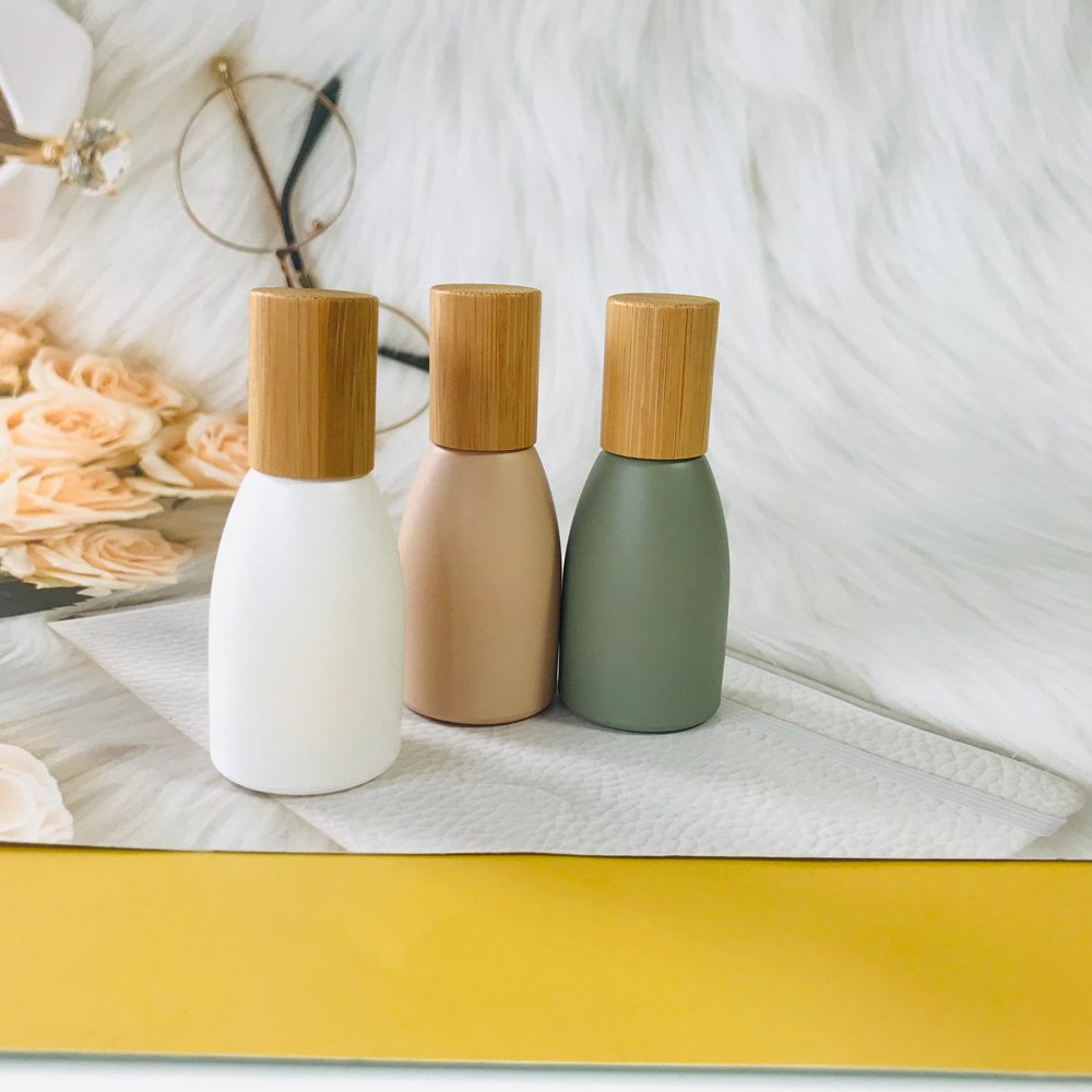Wholesale morandi matte roll on glass bottle 10ml 12ml with wood bamboo lid for essential oil