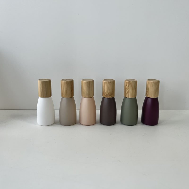 Wholesale morandi matte roll on glass bottle 10ml 12ml with wood bamboo lid for essential oil