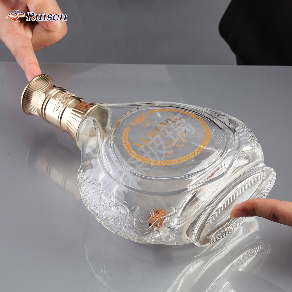 Custom Embossed Glass Vodka Bottle 750ML Flat Round Vodka With Crown Cap