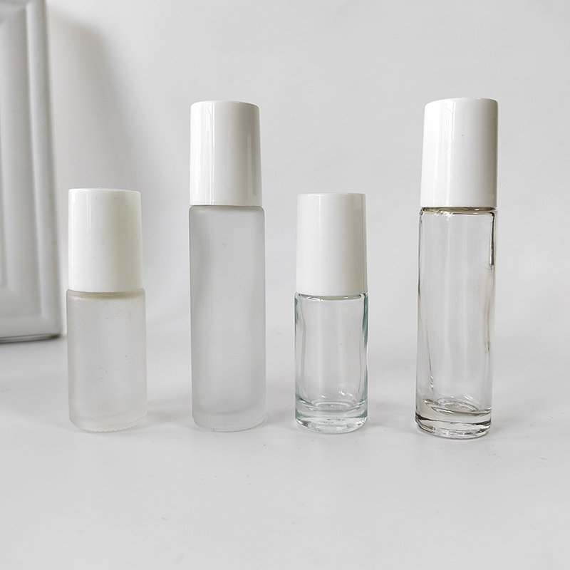 Essential oils roller bottle 5ml 10ml clear frosted glass roll on glass bottle with steel roller and screw white cap