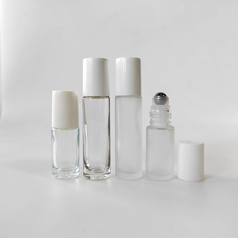 Essential oils roller bottle 5ml 10ml clear frosted glass roll on glass bottle with steel roller and screw white cap
