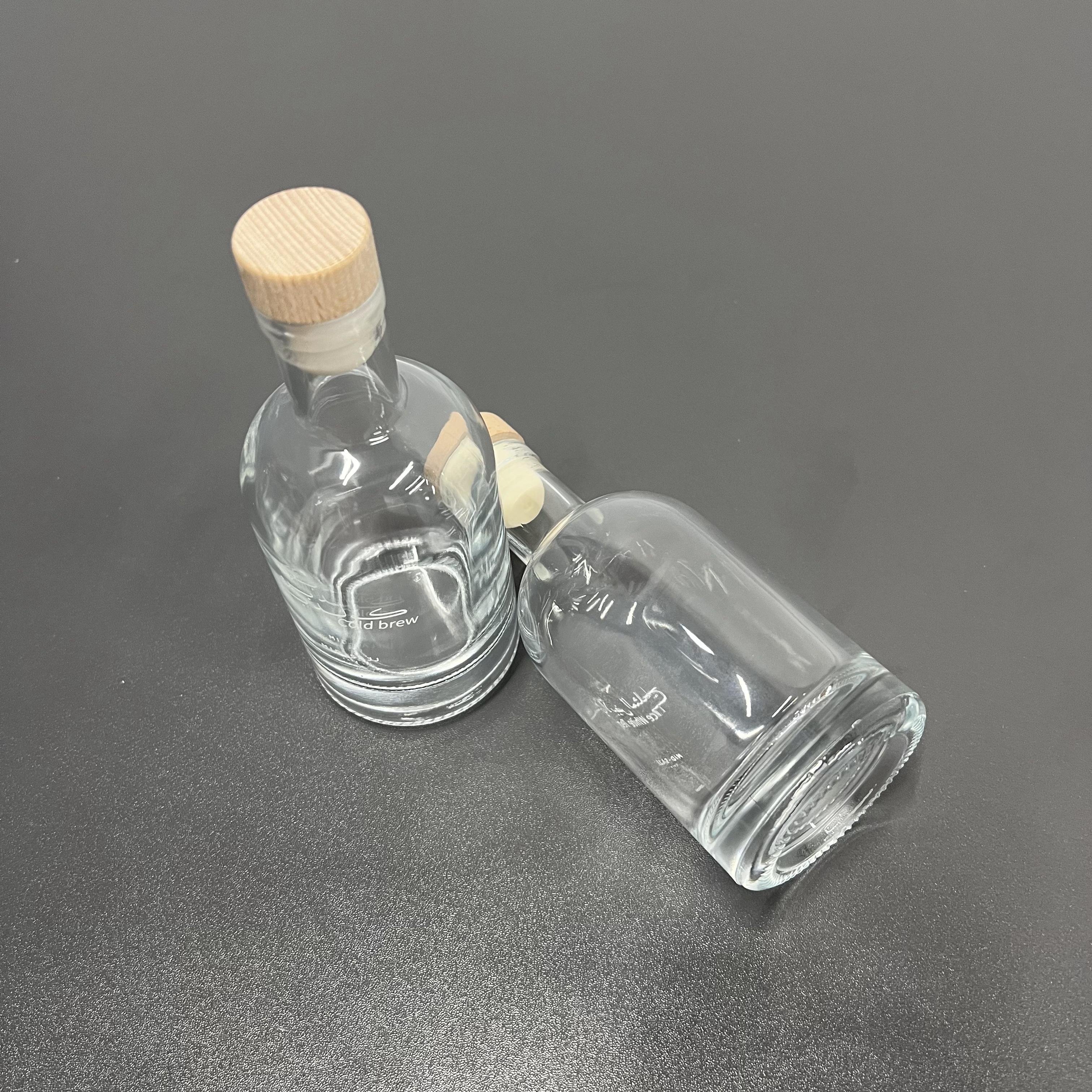 Best quality cheap customized logo printed transparent clear fruit juice wine packaging glass bottle with cork for beverage shop