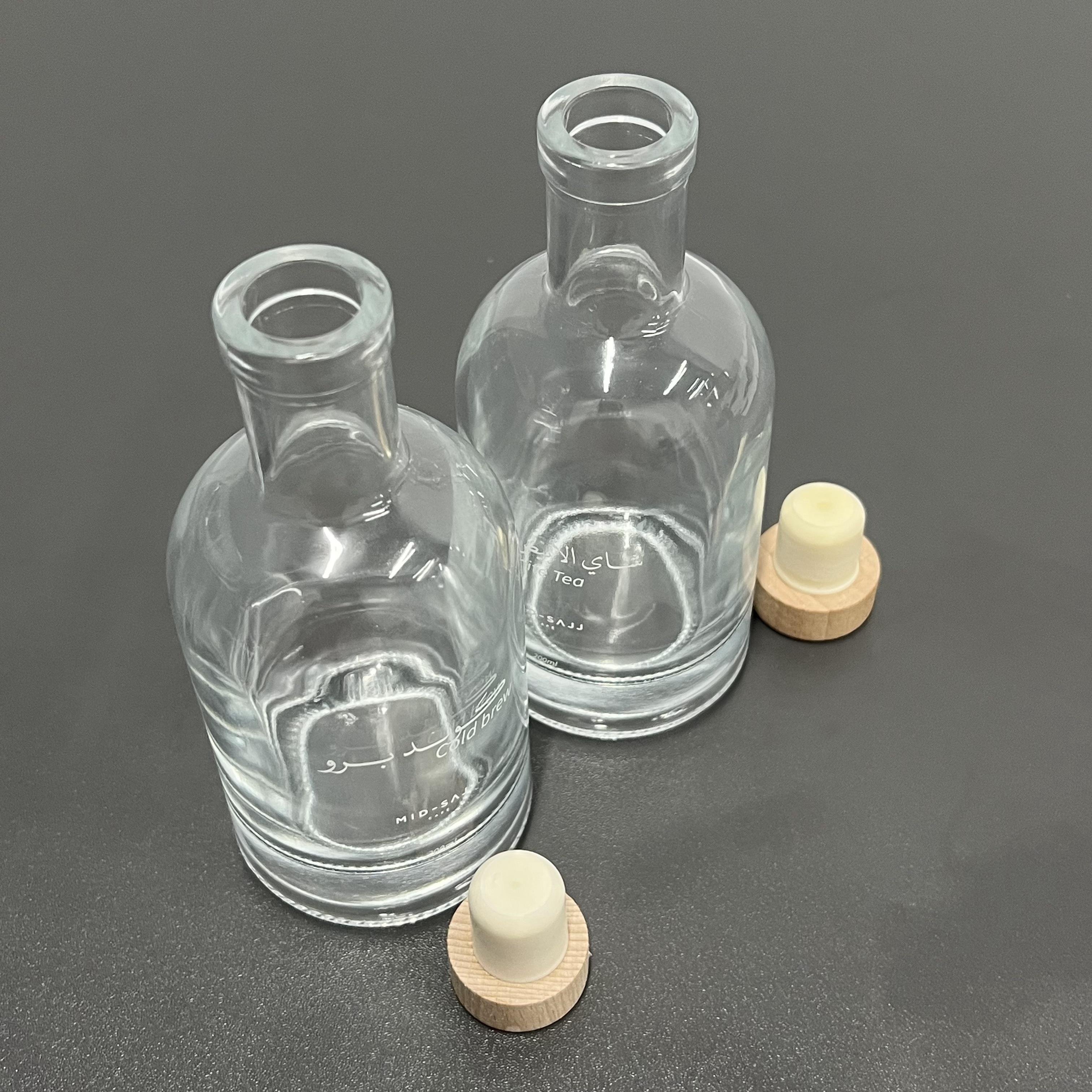 Best quality cheap customized logo printed transparent clear fruit juice wine packaging glass bottle with cork for beverage shop