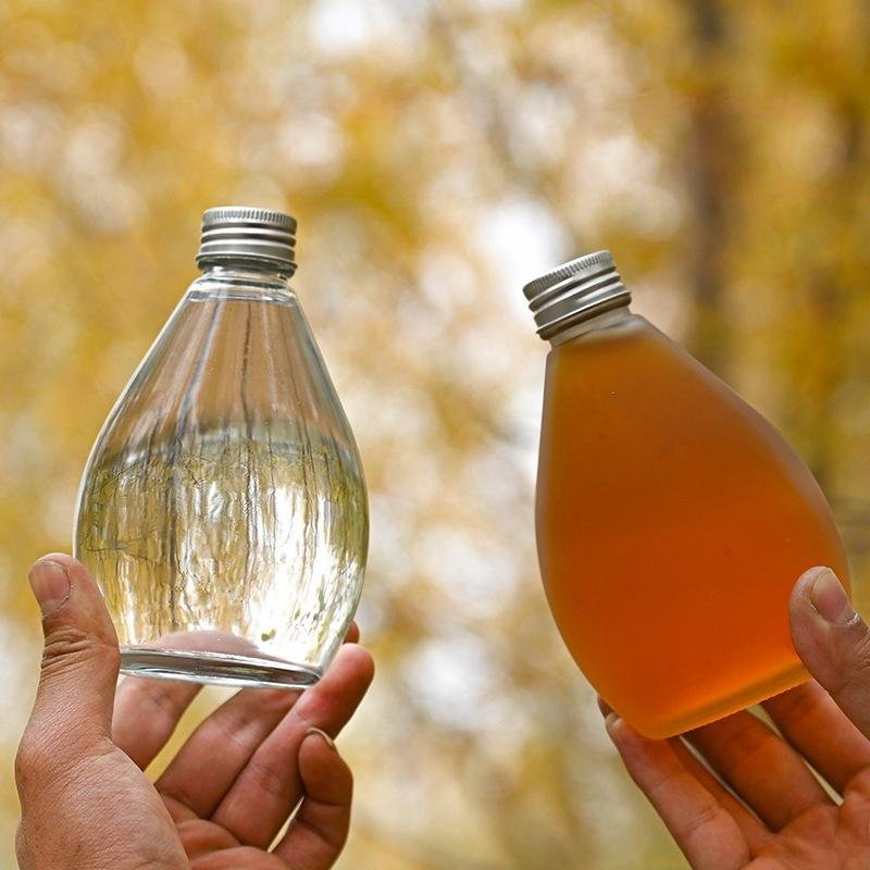 Cheap Export Beverage Juice Sodas Packaging Transparent Glass Bottle Glass Fruit Juice Bottle