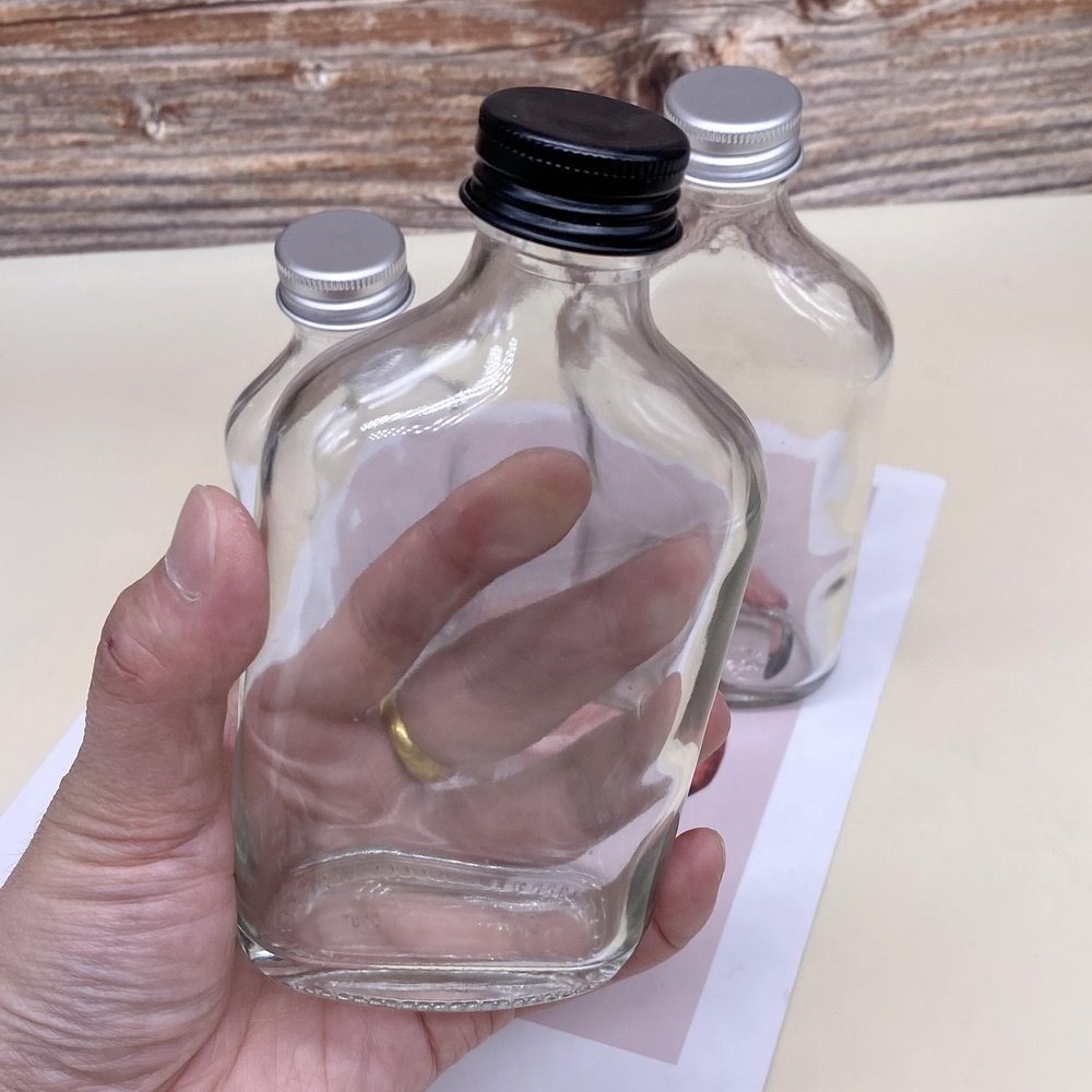 wholesale flat round empty liquor glass bottle with screw lid coffee milk juicer clear glass packaging container 200ml 350ml