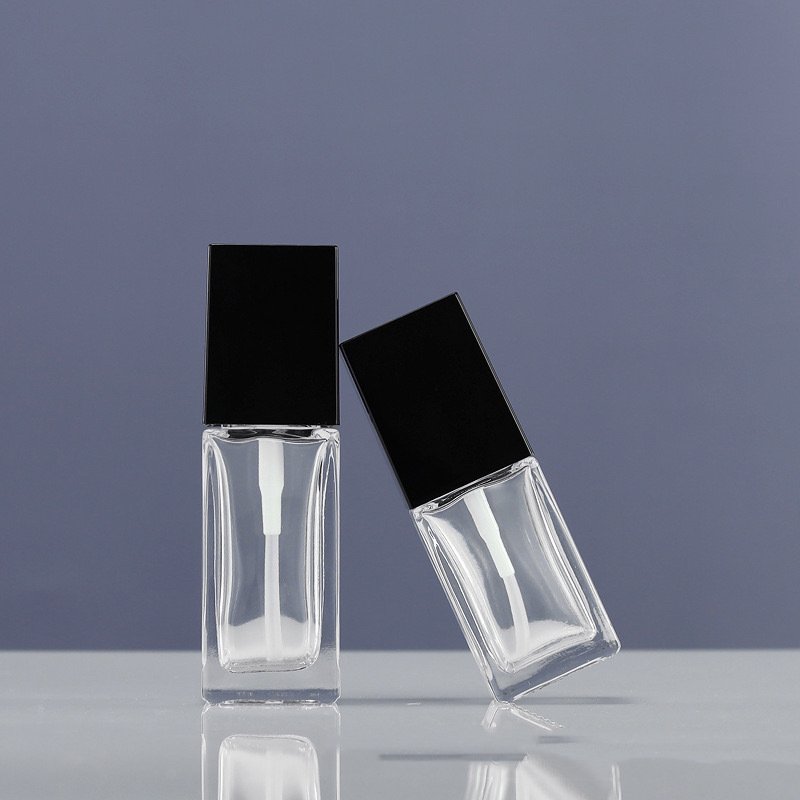 Wholesale transparent square glass bottle emulsion 25ml 30ml liquid Foundation isolation cream pressing bottle