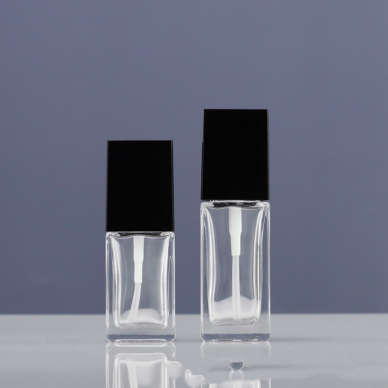 Wholesale transparent square glass bottle emulsion 25ml 30ml liquid Foundation isolation cream pressing bottle