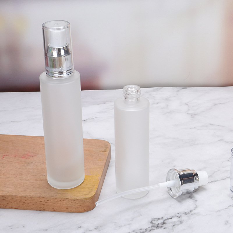 Wholesale spot cosmetic travel dispenser Empty bottle pressed fine mist spray Emulsion matte glass pump bottle