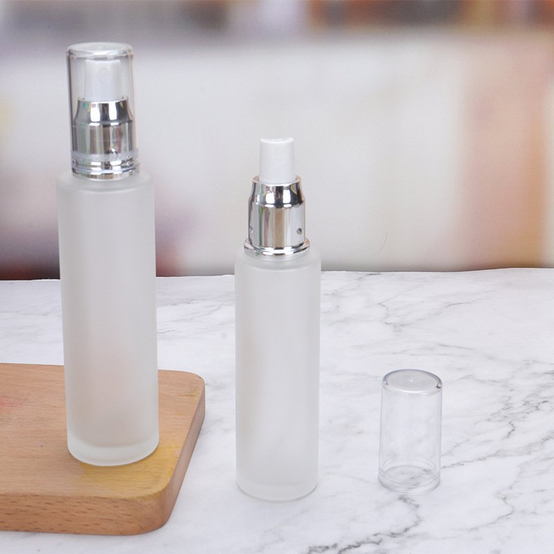 Wholesale spot cosmetic travel dispenser Empty bottle pressed fine mist spray Emulsion matte glass pump bottle