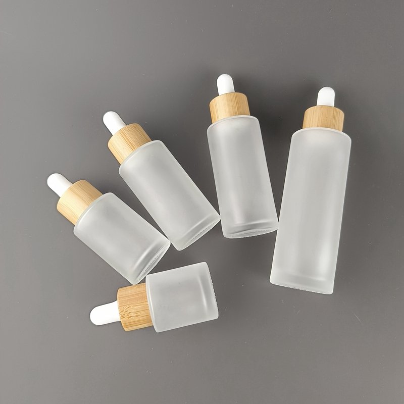 Flat shoulder glass bottle 30 ml 50 ml 60 ml frosted glass bottle cosmetic dropper serum dropper bottle with bamboo dropper