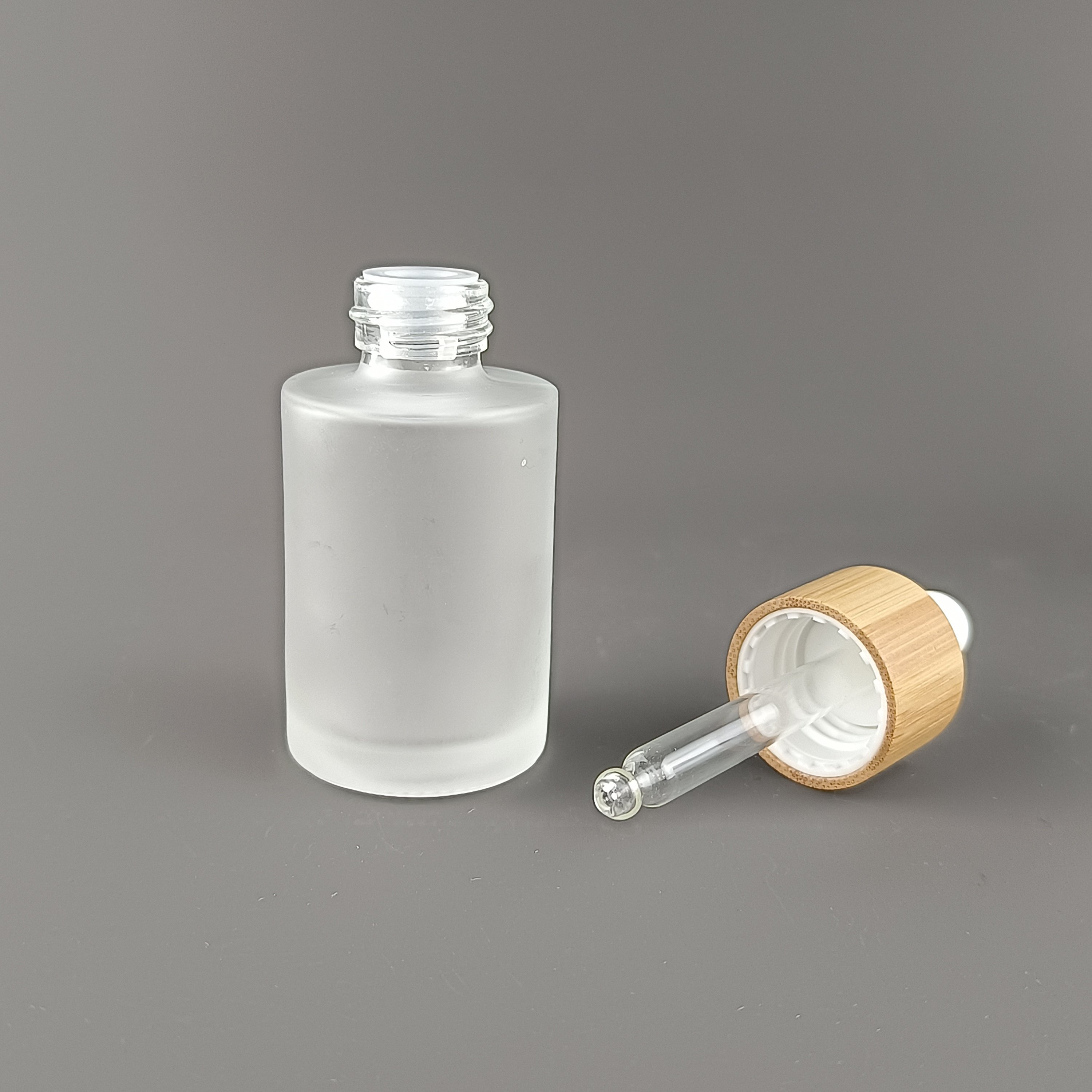 Flat shoulder glass bottle 30 ml 50 ml 60 ml frosted glass bottle cosmetic dropper serum dropper bottle with bamboo dropper