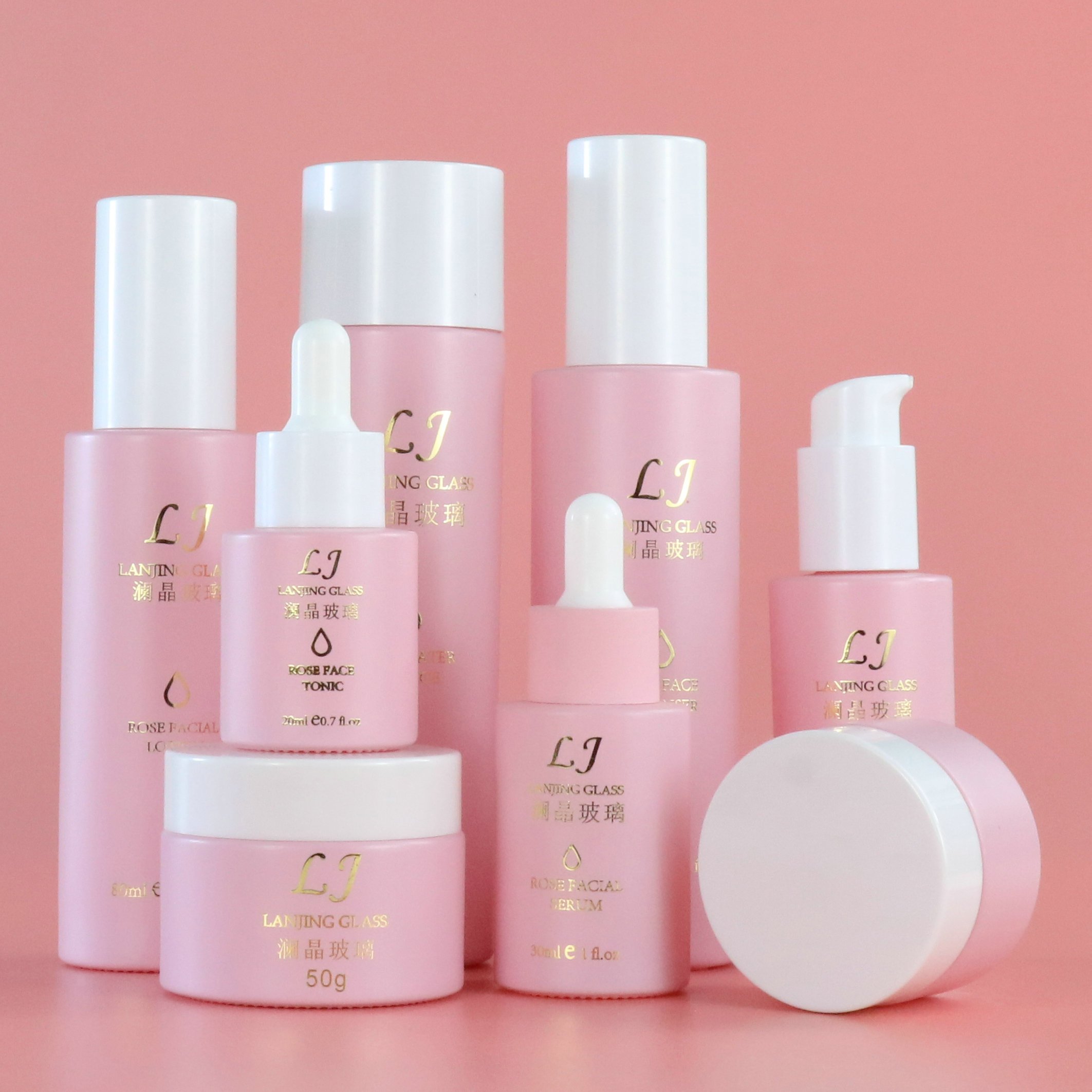Luxury 120ml 100ml empty pink round frosted bottle glass skincare pump cosmetic packaging