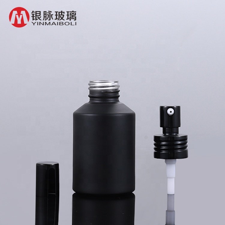 Cosmetic packaging amber glass spray bottles 100ml frosted black glass bottle with black pump