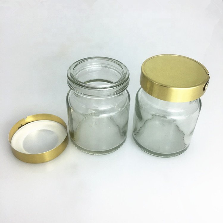 Popular sell 50ml 75ml 100ml empty clear custom screw mouth packing bird's nest bottles glass jam jar with metal lid