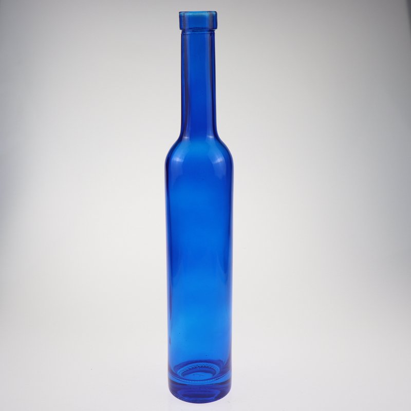 Low price and MOQ Drop shape cobalt blue spirit glass bottle fruit wine bottle tall thin beverage bottle