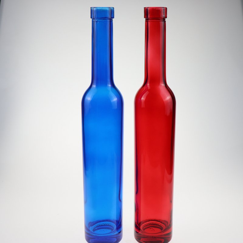 Low price and MOQ Drop shape cobalt blue spirit glass bottle fruit wine bottle tall thin beverage bottle