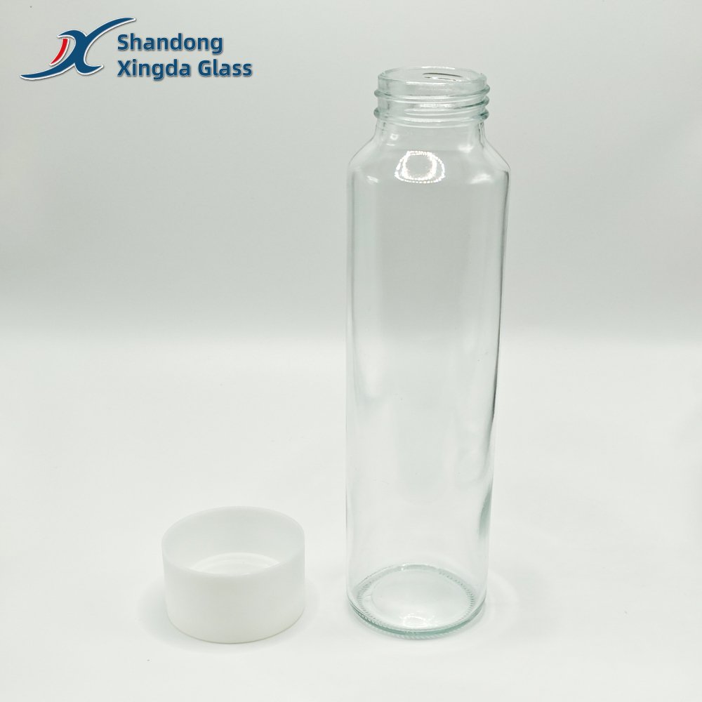 Xingda Glass Water Bottle Transparent Beverage Cylinder Glass Bottle with Plastic Screen Printing for Juice Water Drinks Soda