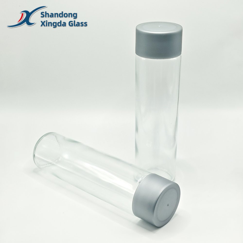 Xingda Glass Water Bottle Transparent Beverage Cylinder Glass Bottle with Plastic Screen Printing for Juice Water Drinks Soda