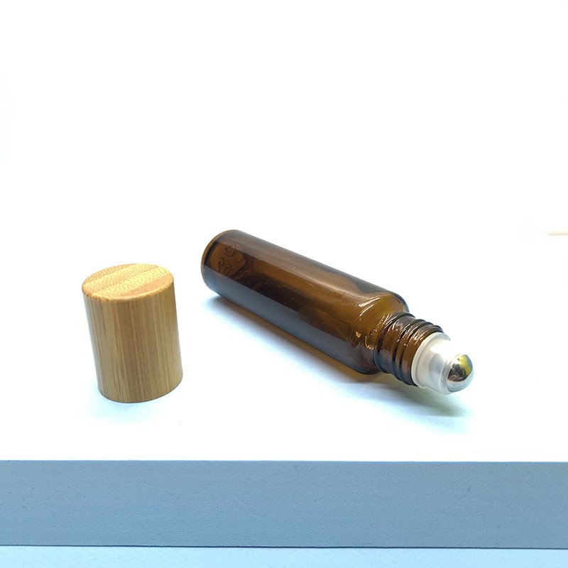 Hot Sale 10ml Amber Roll On Bottle Bamboo Cap Essential Oils Roller Ball Glass Bottle Clear Glass Roller Bottle
