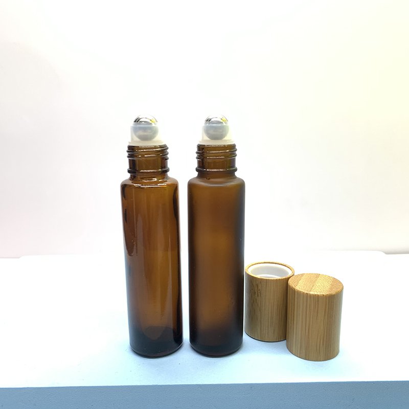 Hot Sale 10ml Amber Roll On Bottle Bamboo Cap Essential Oils Roller Ball Glass Bottle Clear Glass Roller Bottle
