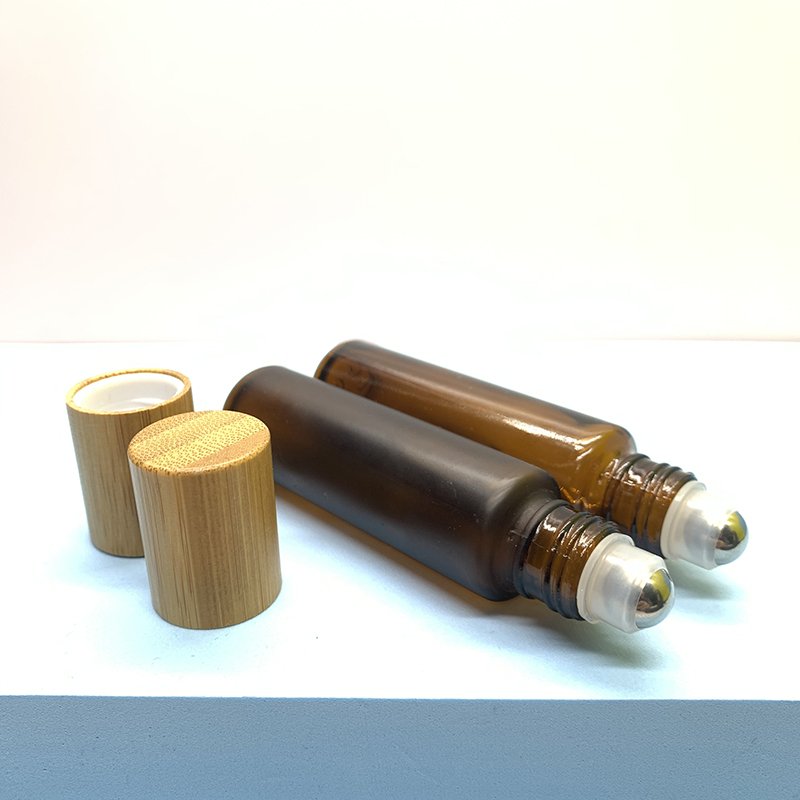 Hot Sale 10ml Amber Roll On Bottle Bamboo Cap Essential Oils Roller Ball Glass Bottle Clear Glass Roller Bottle