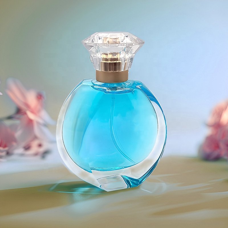 Wholesale Luxury Recyclable Custom Flat Round Shape Clear Empty Glass Perfume Spray Atomizer Bottle 50ml