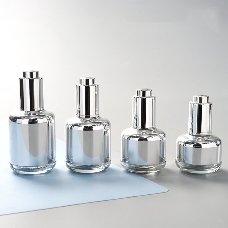 30ml 40ml 50ml 1fl 2oz empty round skincare oil packaging gold silver serum bottle with push button pump dropper