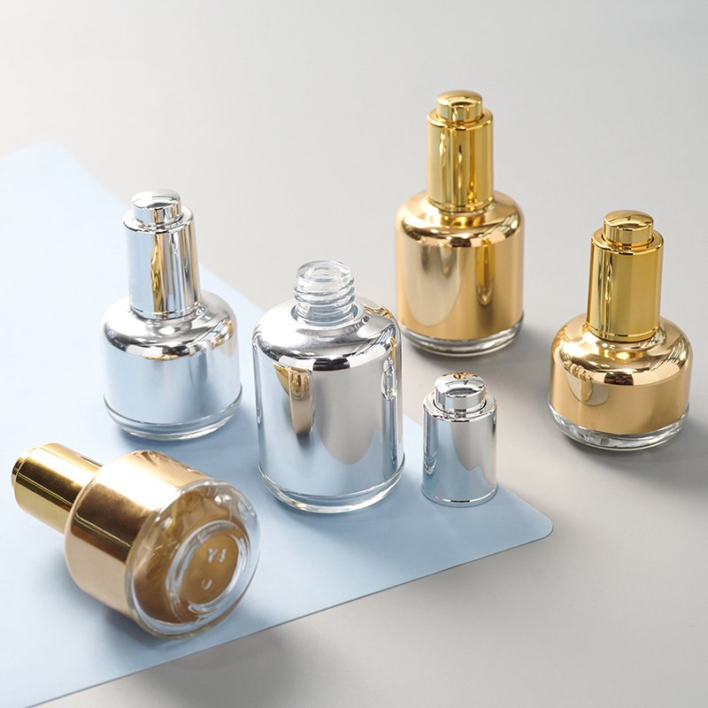 30ml 40ml 50ml 1fl 2oz empty round skincare oil packaging gold silver serum bottle with push button pump dropper