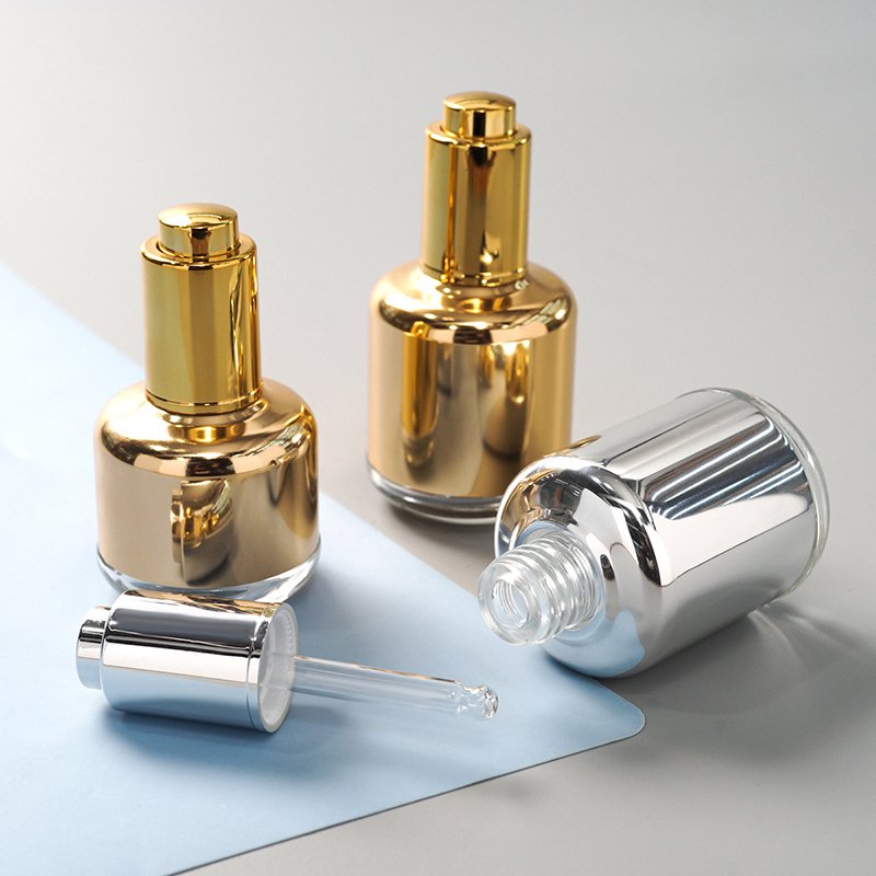 30ml 40ml 50ml 1fl 2oz empty round skincare oil packaging gold silver serum bottle with push button pump dropper