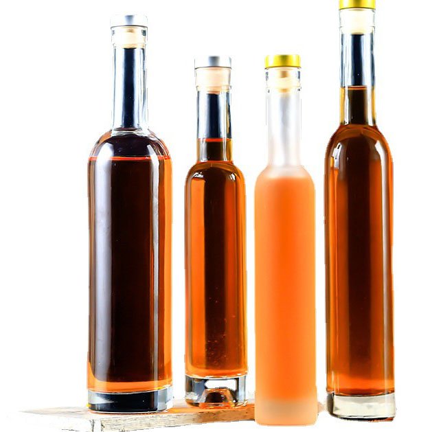 Best selling price empty glass bottles with lids water glass bottles for juice