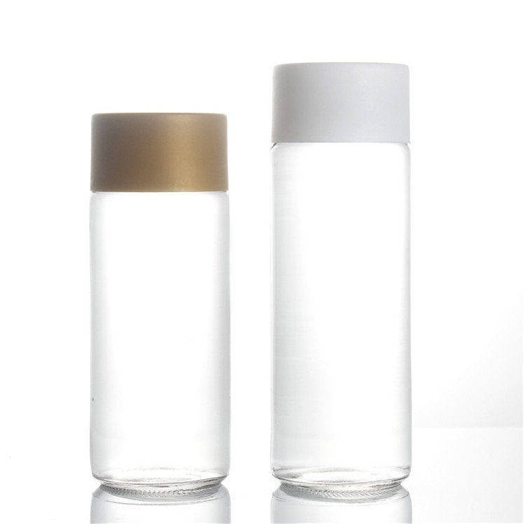 botella de agua de vidrioClear Mineral Water Juice Beverage Glass Bottle Custom Logo Print Glass Drinking Water Bottle with Cap