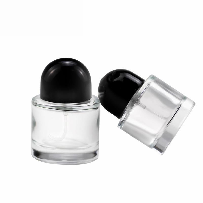 Wholesale price 30ml / 50ml / 100ml round empty perfume bottle black cap spray glass bottle