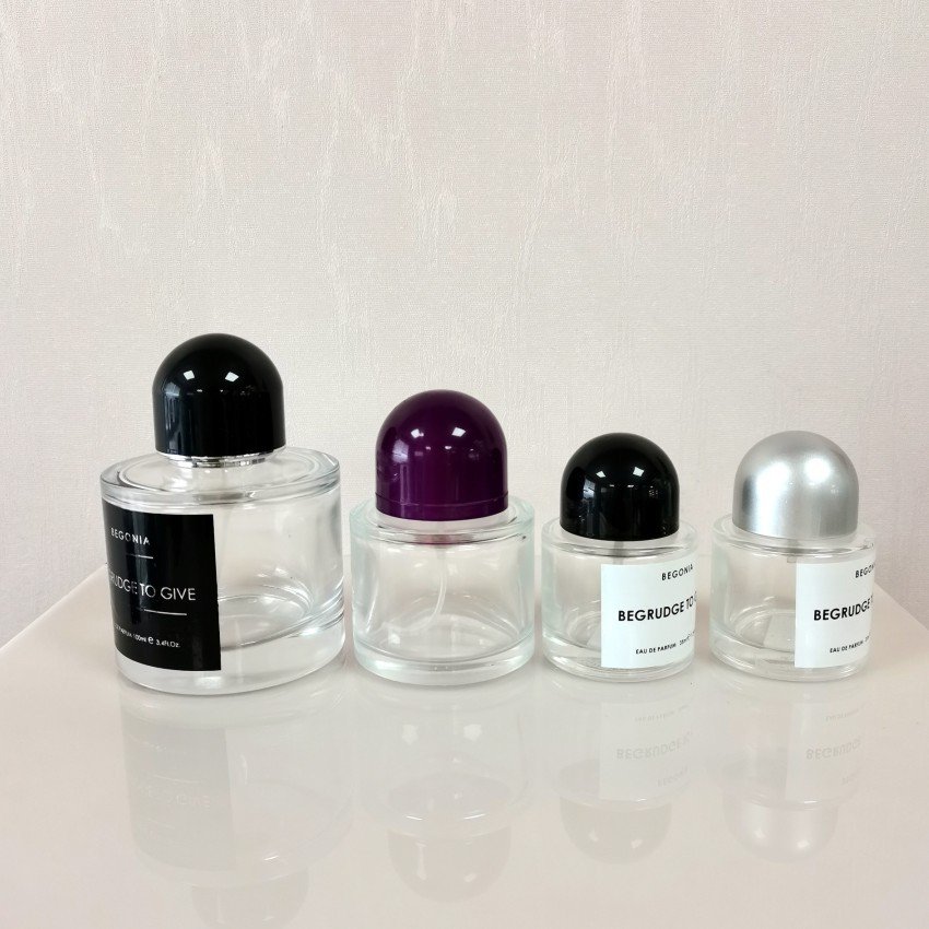 Wholesale price 30ml / 50ml / 100ml round empty perfume bottle black cap spray glass bottle