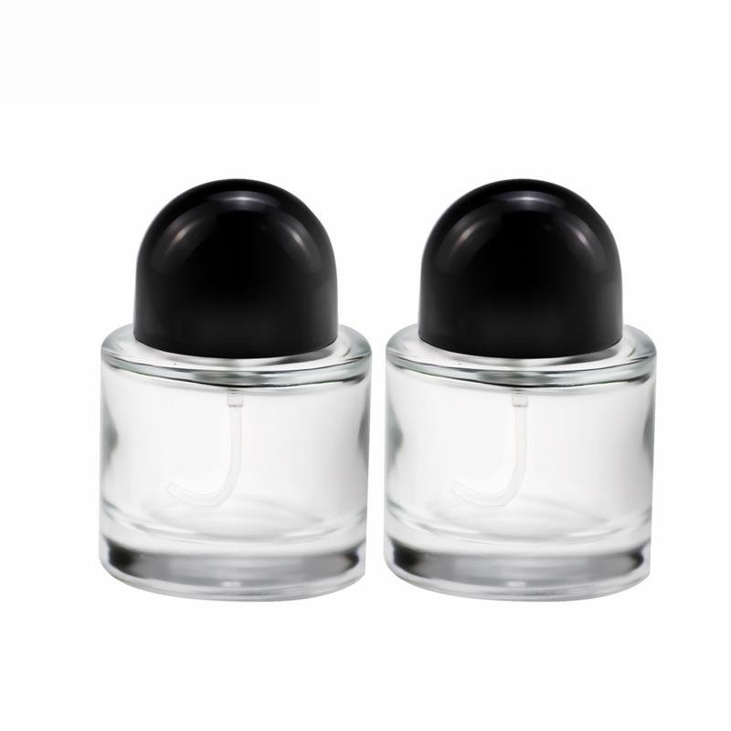 Wholesale price 30ml / 50ml / 100ml round empty perfume bottle black cap spray glass bottle
