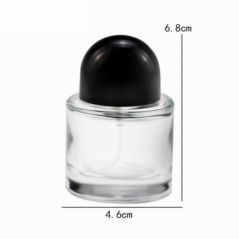 Wholesale price 30ml / 50ml / 100ml round empty perfume bottle black cap spray glass bottle