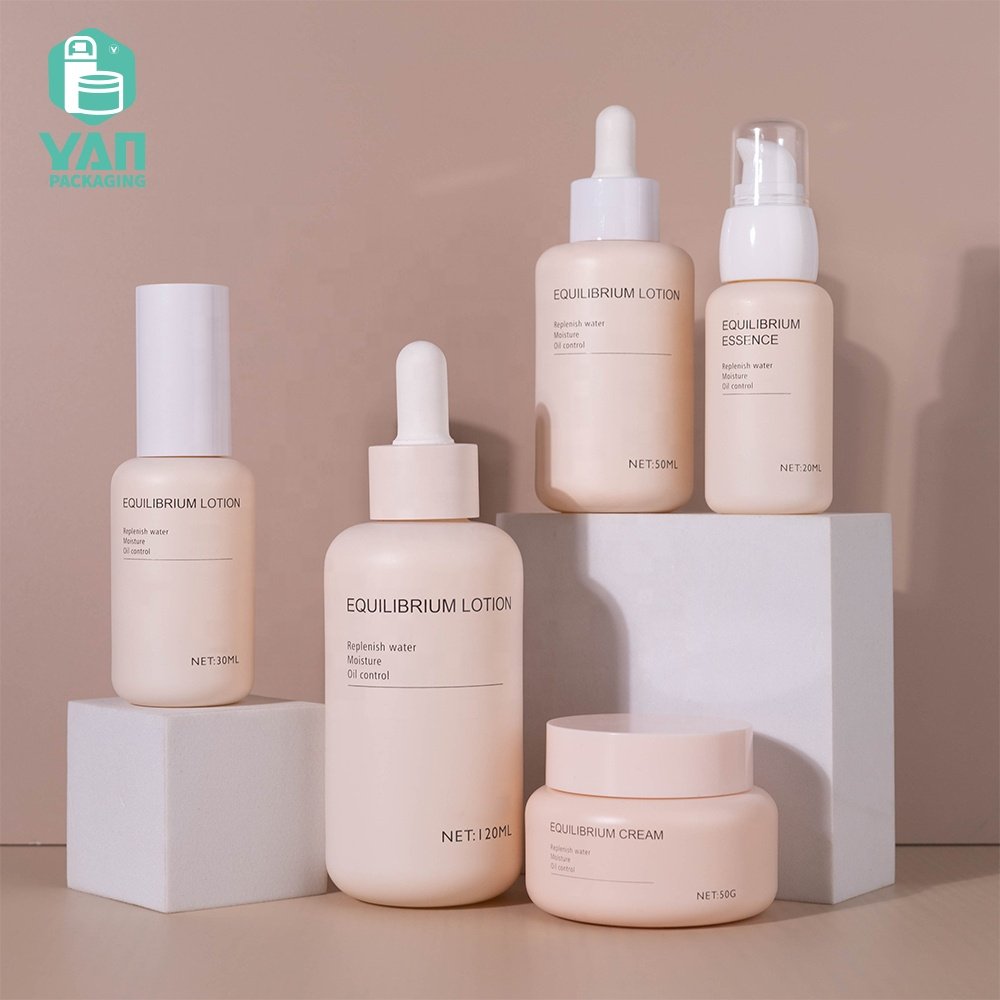 YAN Packaging fancy matte pink color european luxury skincare packaging set dropper pump glass bottle jar